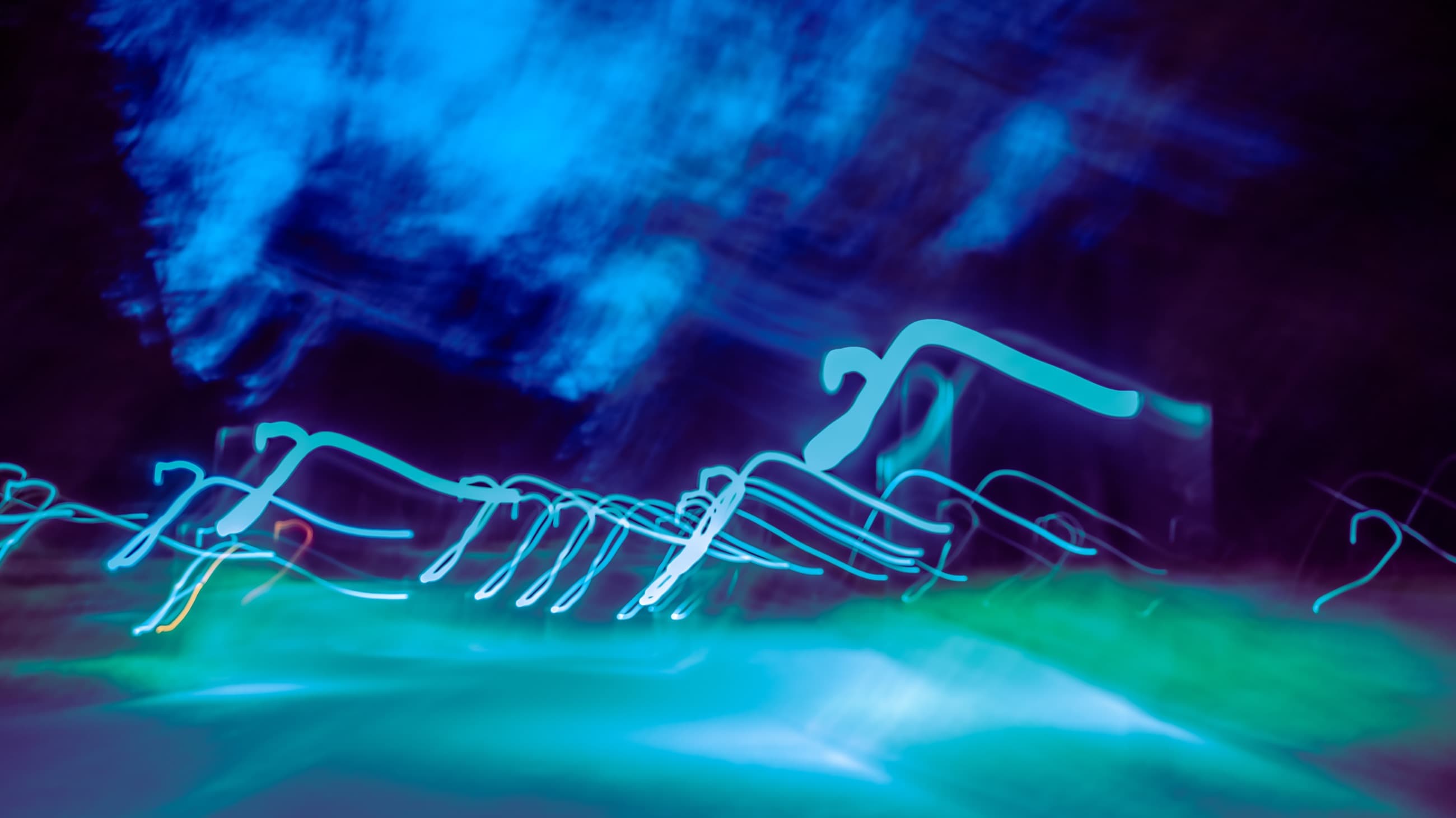 Blue and cyan light trails at night